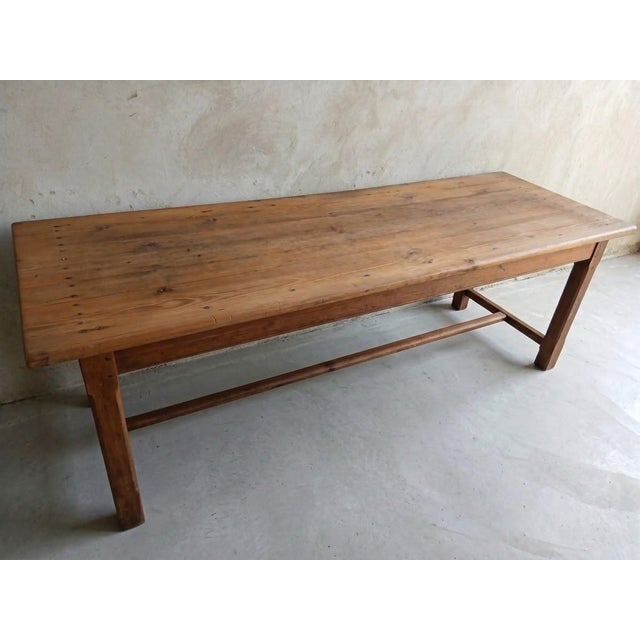 Embrace the essence of Organic Modernism with this striking 19th-century French farmhouse table, masterfully sourced and...