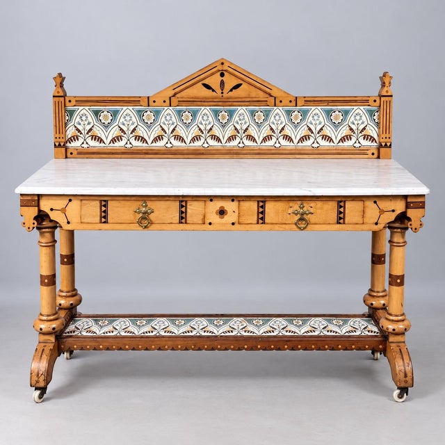 An exceptional and rare late Victorian Reformed Gothic washstand in beautifully figured maple, the design attributed to...