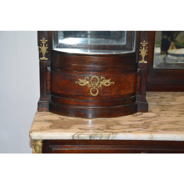 We are offering an elaborate French Vitrine with outstanding flame Mahogany and ornate bronze hardware along with quality...