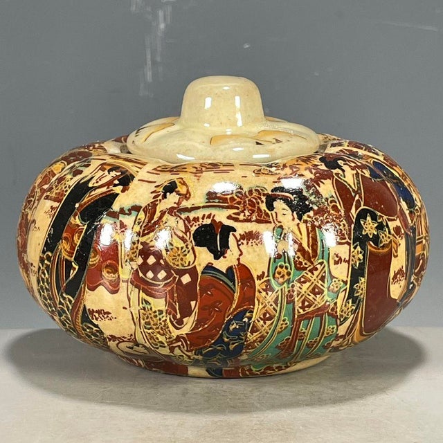 This is a fine antique Japanese Satsuma lidded jar, dating to the late Meiji or early Taisho period. The piece features...
