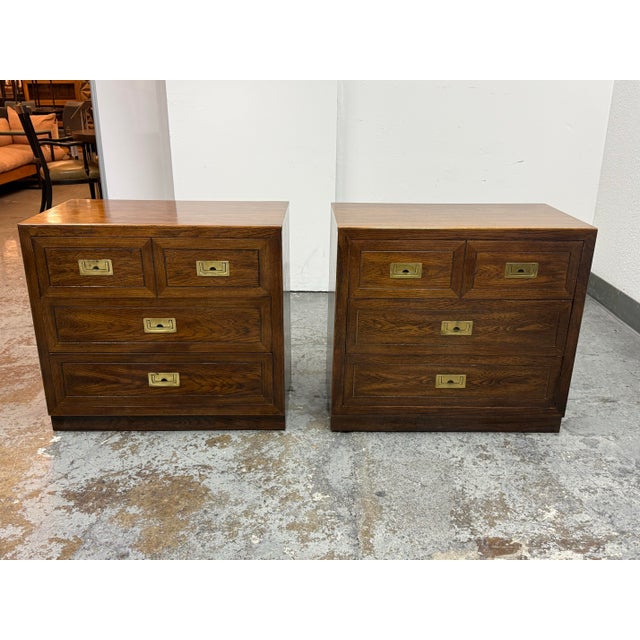 Design Plus Gallery presents a pair of Vintage Dixie Furniture ACT II Collection Italian Campaign Nightstands, Circa...