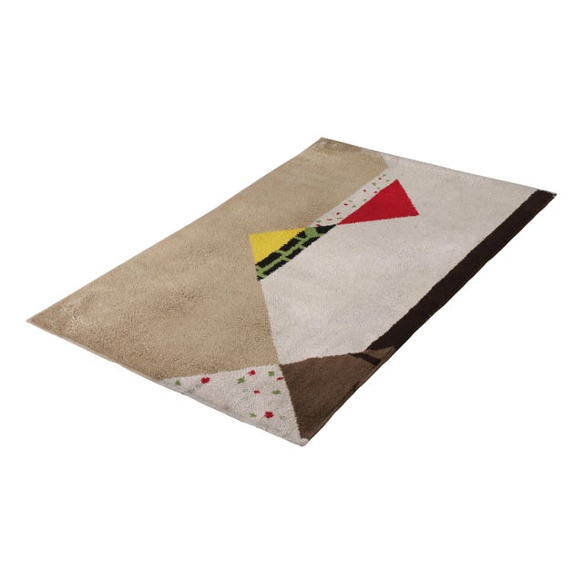 Hand-knotted in wool originating from France circa 1910-1920, this 3x15 antique rug connotes an Art Deco design in a...