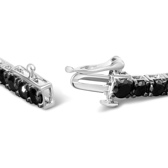 Elegant and timeless, this gorgeous .925 sterling tennis bracelet features 8.0 carat total weight of natural round...