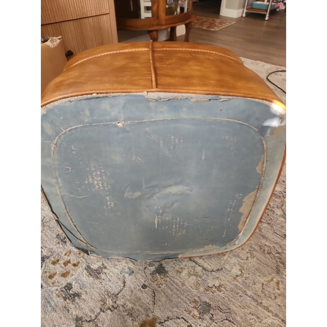 Add a touch of classic Mid-Century Modern style to your space with this vintage brown hassock footstool. Featuring a...