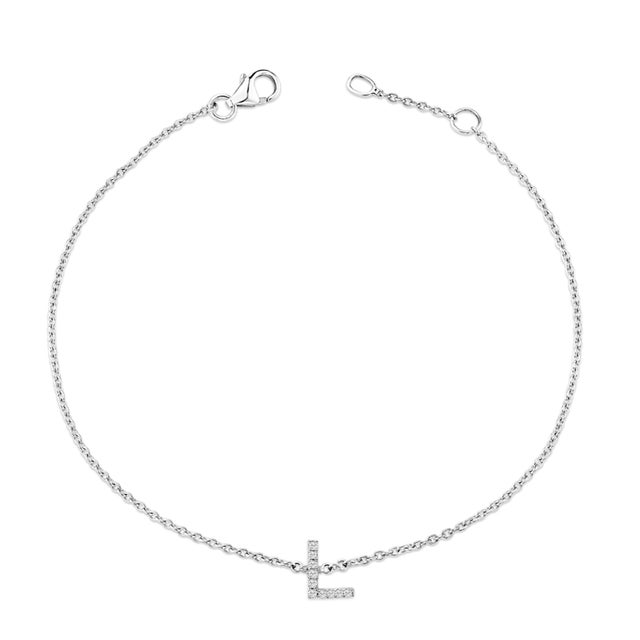 Immerse yourself in the understated elegance of this 10K white gold bracelet, rhodium-plated for an enrapturing shimmer...