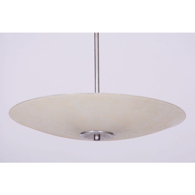 This timeless pendant chandelier, originating from the 1940s, represents an excellent and highly elegant example of...