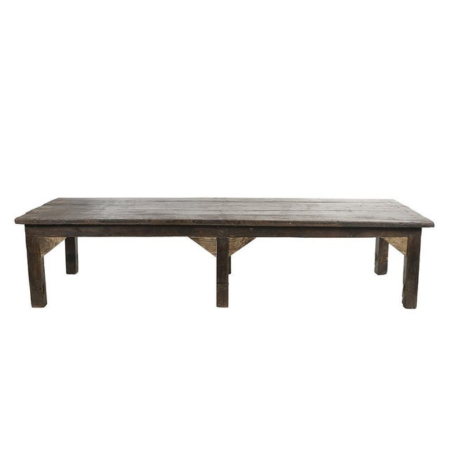 Large old table (20th century) in wood. This piece is designed in the style of the selected designer and/or manufacturer,...