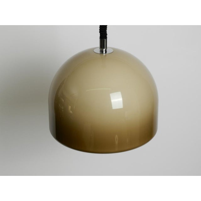 Beautiful 1960s space age pendant lamp with a plastic shade. manufacturer is staff. Made in germany. shade is made of a...