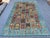 This captivating Bakhtiari rug showcases the iconic garden panel design: a grid of individual compartments, each holding...