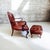 The Ultimate Statement of Traditional Elegance: The Leathercraft Open Armchair & Tufted Ottoman Set Experience the...