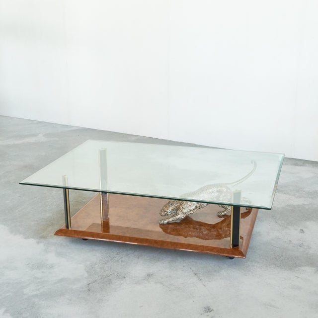 Nicola Voci 'Jaguar' Coffee Table in Bronze, Burl Wood and Beveled Glass 1970s. This is a spectacular and high-end coffee...