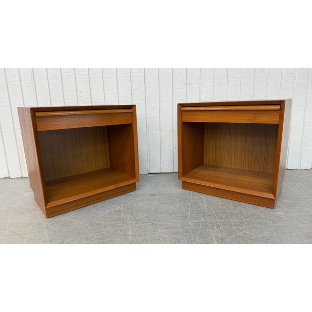 This listing is for a pair of Vintage Danish Modern Teak Nightstands. Featuring a straight line design, single drawer with...