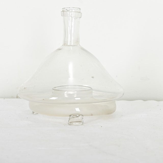 Dimensions: 7 ½” H x 7 ⅛” W x 7 ⅛” D A unique handmade fly catcher, of mouth-blown clear glass from France, 19th century....