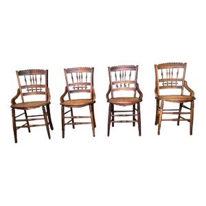 Early 20th Century Antique Victorian Eastlake Style Walnut Carved and Spindle Cane Seat Dining Side Chairs- Set of 4
