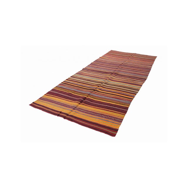 Handwoven vintage striped decorative kilim rug from Denizli region of Turkey. Approximately 50-60 years old. In very good...