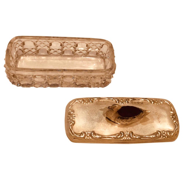 A turn of the century pin box with a duck on the lid which is a holder for stick pins. It is sterling silver with a...