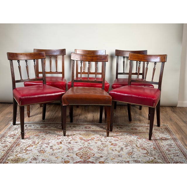 This assembled set of six English George III–style dining chairs brings together four late 18th-century examples with two...