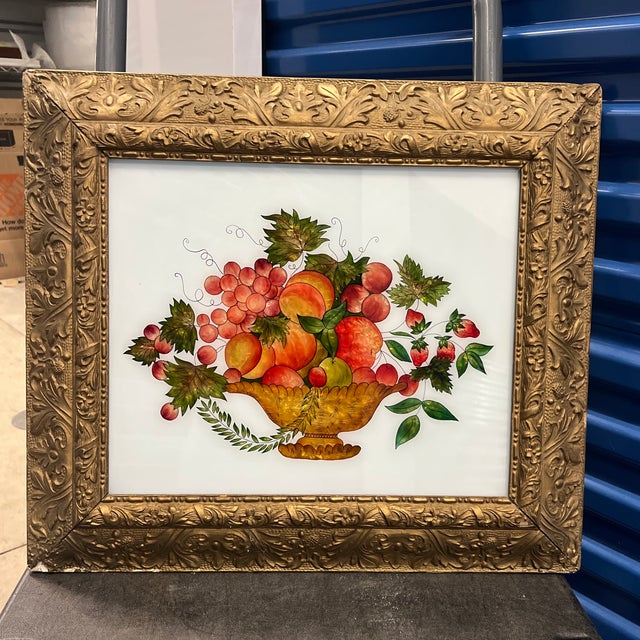 Antique Reverse Painted tinsel painting of theorem style Still Life Fruit Basket in Antique Gilded Frame This artwork is a...