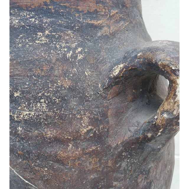 This beautiful and very old Moroccan brown jar / vase is unique and like no other, making it a great add-on to any home or...