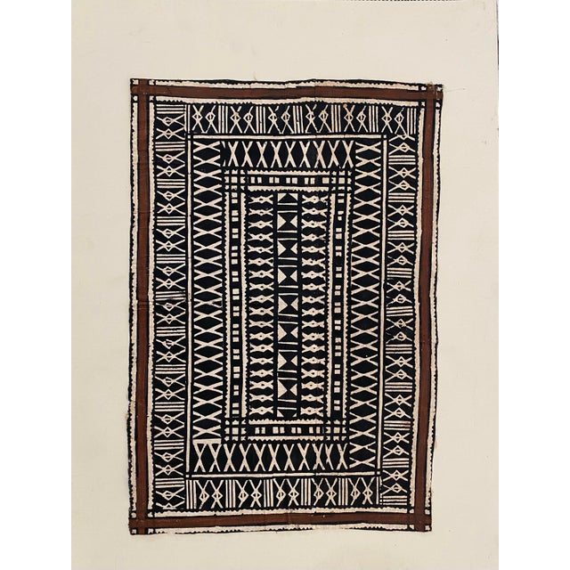 Hand-painted West African mud cloth–style textile featuring bold geometric motifs rendered in deep black against a natural...
