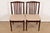 A sleek and stylish pair of mid-century Danish Modern sculpted rosewood side chairs or dining chairs By Vamdrup...