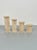 Set of four candle holders in travertine marble in the shape of ancient walls made in Italy in the 1970s. The four pieces...