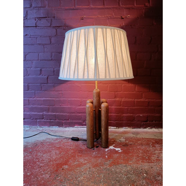 Spectacular lamp produced in the early 70s by the German-Swiss Temde Leuchten AG. The lamp has four cylindrical oak...
