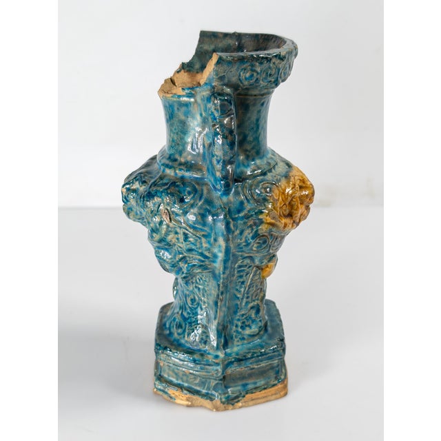 We are selling this pretty Chinese Ming style Fahua glazed vase. This vase has molded pottery form with swirling dragon...