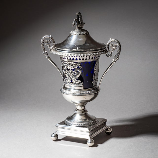 An elegant French silver drageoir or bonbonnière with a removable cobalt blue glass liner and a gilt interior. The lid is...