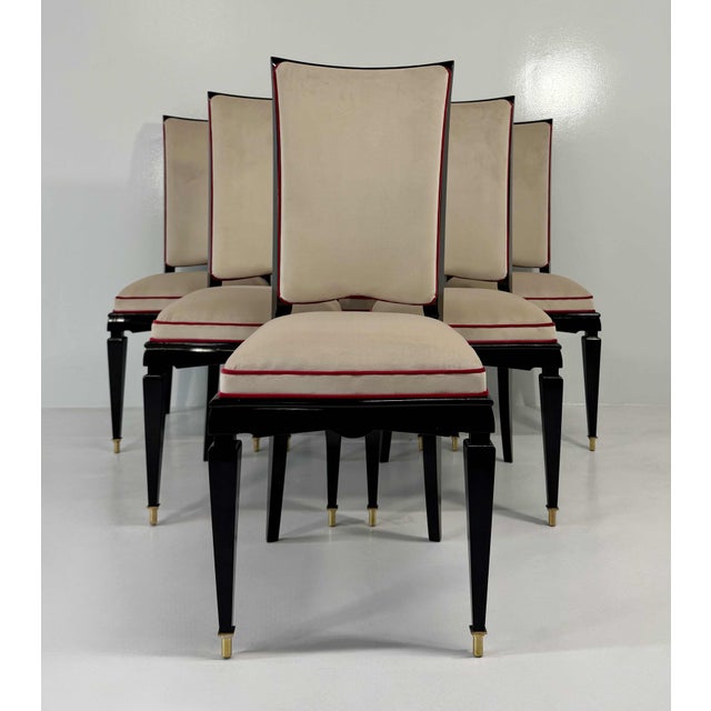 Elegant set of six French Art Deco dining chairs, made in France in the 1940s. The black-lacquered wooden frames feature...