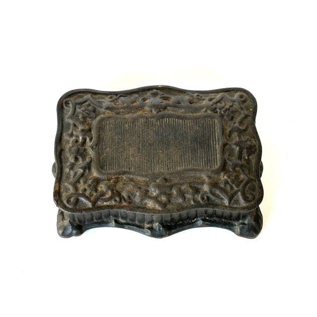 This late 19th century cast iron box made by E.G. Zimmerman Hanau Germany is a cool antique collectible. The vintage cast...