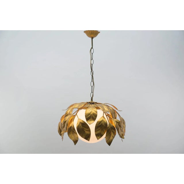 A very rare Florentine hanging lamp with an opal glass ball as a light source. It is very elegant and in a very good...