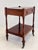 A handsome English mahogany side table dating to the early to mid-20th century, incorporating traditional Georgian details...