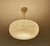 Art Deco pendant lamp from the 1930s, ivory marble glass shade with darker veins, translucent bakelite glass holder ,...
