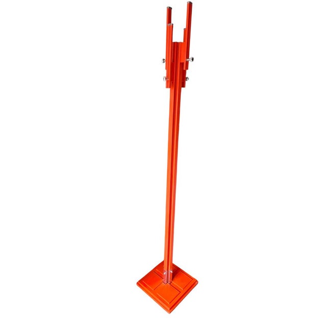 Orange coat hanger by Carlo De Carli for Fiarm. It's in excellent condition, with its vibrant color still visible. Two of...