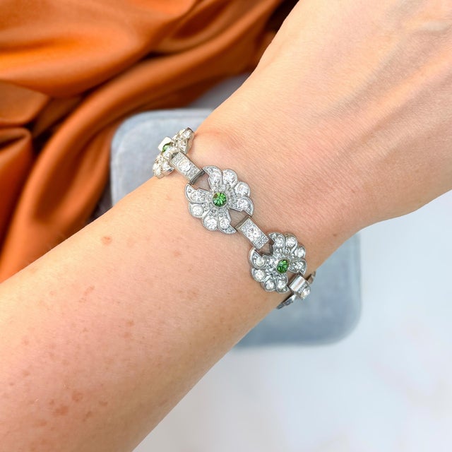 This pretty bracelet dates from the 1930s. It features a lovely floral design, which can be enjoyed for centuries to come....