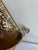 Ornate Hosley metal wall pocket featuring embossed floral motifs, rope-style edging, curled side accents, and a circular...