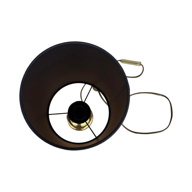 Bedside or table lamp in the classicist style, Hollywood Regency, made in Germany in the 1970s. Lamp with a brass base,...