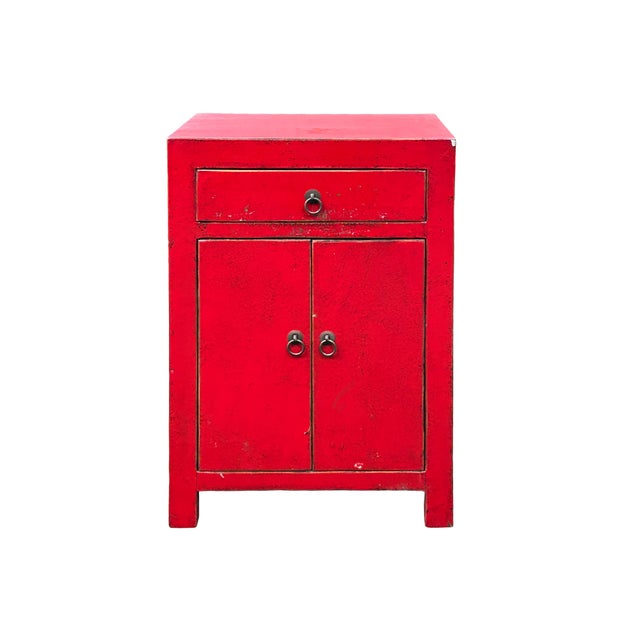 This striking Chinese accent cabinet features a vibrant red lacquer finish that instantly commands attention. Its...