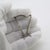 A vintage miniature depicting a musical harp, handcrafted in silver in Italy between the 1970s and 1980s, representing the...