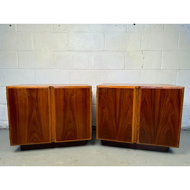 Add a touch of timeless elegance to your bedroom with this Lane Mid-Century Modern Pair of Walnut Cabinet Nightstands....