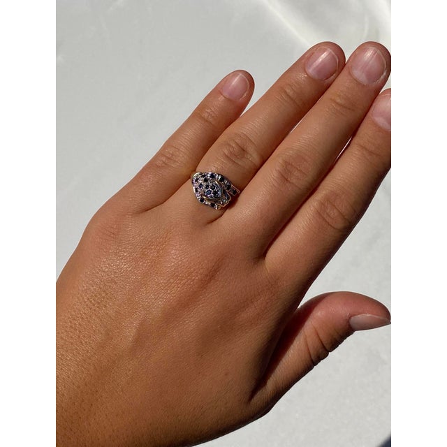 The 11th Street: Big Cat Sapphire and Diamond Ring in Yellow Gold. This captivating ring depicts a majestic feline with...