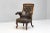 Fantastic rosewood framed armchair in original leather with deep buttoned and exposed back. Fabulous quality and design.