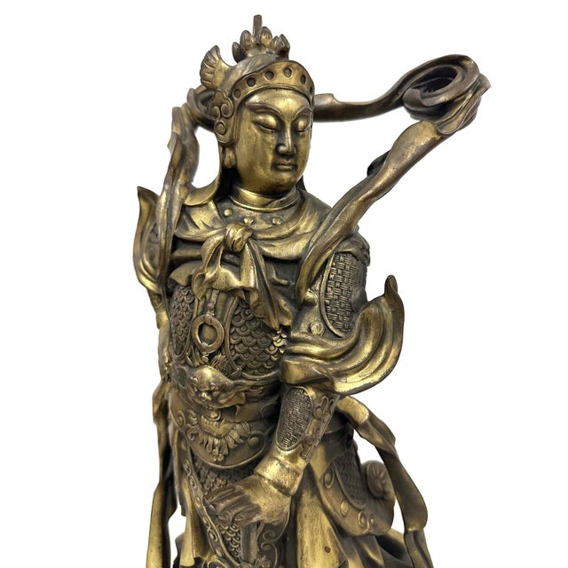 The statue in the image is a depiction of Wei Tuo Bodhisattva (also known as Skanda), a major protective deity and dharma...