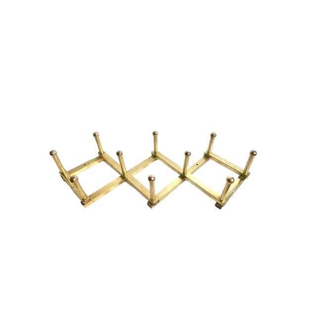 Vintage mid century Italian brass coat hat rack. This rack does not fold. It is in the accordion style but is in a fixed...
