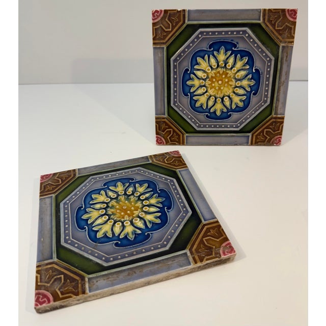 Early 20th Century Japanese Decorative Tiles A matched pair of glazed ceramic tiles by Saji Tile Works, featuring a...