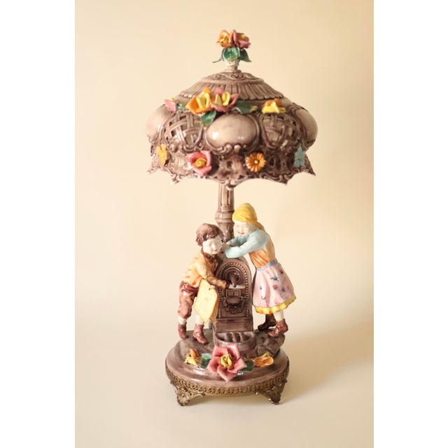 This is a rare and highly collectible mid-20th-century Italian Capodimonte porcelain table lamp, measuring 23 inches in...