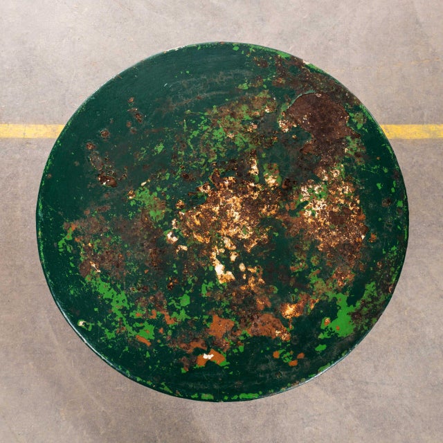 1950’s French Dark Green Metal Round Outdoor Small Gueridon Table. Classic French gueridon table with three solid bar hand...