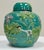 Absolutely stunning antique Majolica style turquoise green hand-cast lidded ginger jar featuring vibrant flora and fauna...