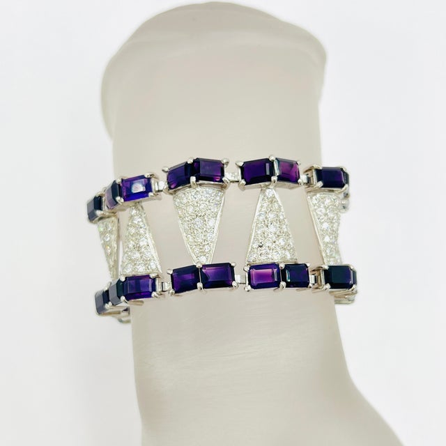 Gorgeous amethyst emerald cuts with 4.00 ct. of good quality white diamond rounds. Handmade in platinum and palladium....